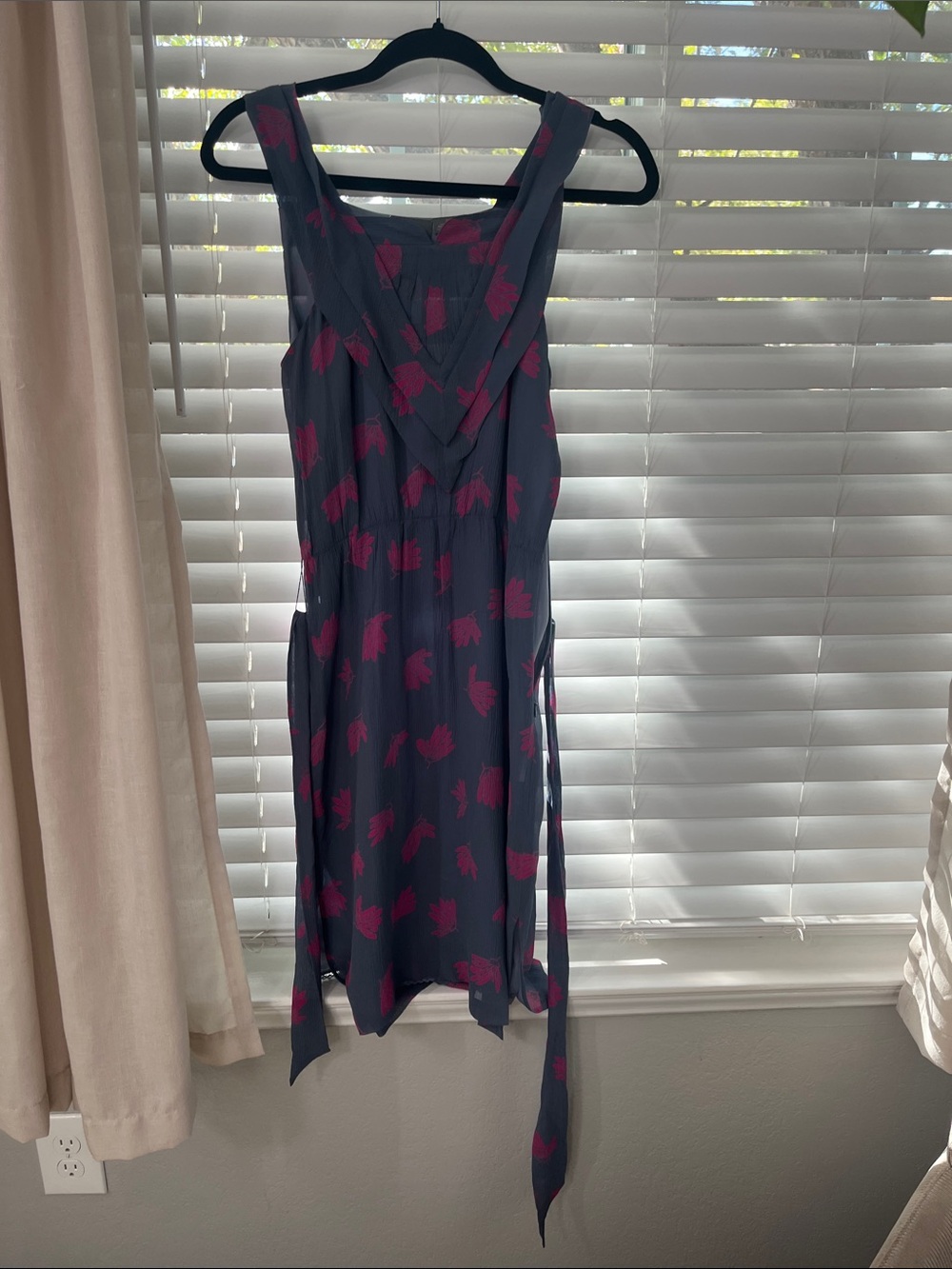 Girl from Savory Navy Dress with Pink Floral Pattern and Wrap Detail
